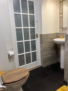 a bathroom with a toilet and a sink at Lovely family seafront property in Burnham-on-Sea in Burnham on Sea