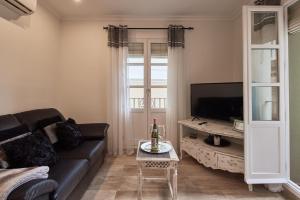 Telewizja i/lub zestaw kina domowego w obiekcie Little Sopranis Little Apartments