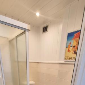 a bathroom with a shower and a glass door at Spectacular Waterfront Views Discover the Hidden Gem of Cronulla with our Rare 3 Bedroom Apartment with Free Parking in Cronulla