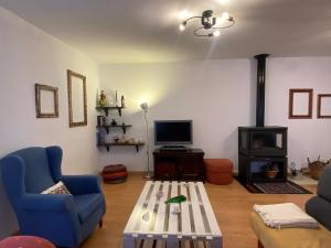 TV a/nebo společenská místnost v ubytování Casa Abuela Francisca