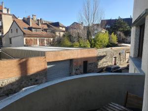 a view from the balcony of a building with a garage at Appartement centre-ville proche lac et thermes in Thonon-les-Bains