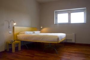 Кровать или кровати в номере San Lorenzo Si Alberga