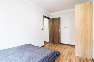Postel nebo postele na pokoji v ubytování Małe Tęczowe Wzgórze