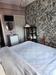 A bed or beds in a room at Guesthouse Monopati - Ξενώνας Μονοπάτι