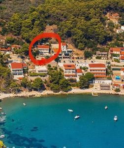 an aerial view of a resort with a large red circle at Apartments Feral in Saplunara