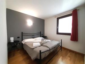 Postel nebo postele na pokoji v ubytování IL RUSTICO Appartamento