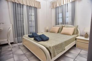 Posteľ alebo postele v izbe v ubytovaní Villa The Cosy Olive