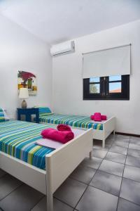 Posteľ alebo postele v izbe v ubytovaní Villa The Cosy Olive