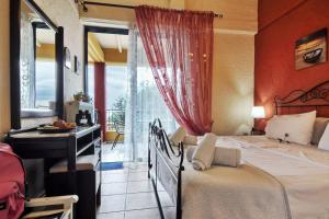 Postel nebo postele na pokoji v ubytování Boundos By The Beach