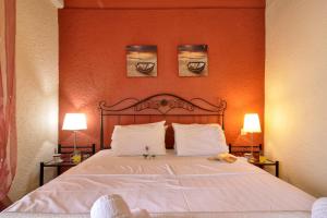 Postel nebo postele na pokoji v ubytování Boundos By The Beach