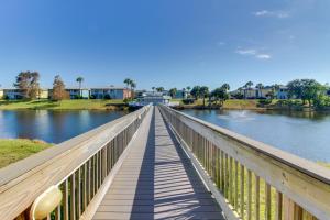 a wooden bridge over a river with houses at Gulf Terrace 126 in Destin