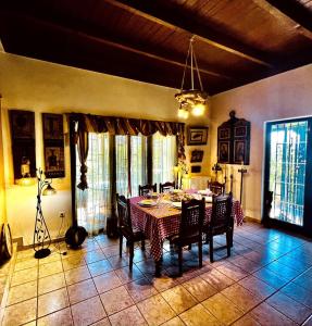 a dining room with a table and chairs at Estate Tsiati - Κτήμα Τσιάτη in Nafplio +23 photos
