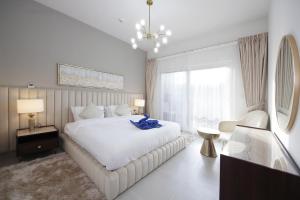 Postel nebo postele na pokoji v ubytování New Arabian Villa Nova