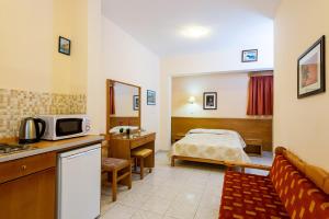 A kitchen or kitchenette at Summer Memories Aparthotel