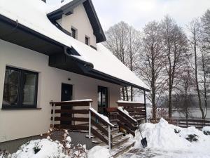 a house with snow on the roof of it at Dom nad Bliznem in Walne