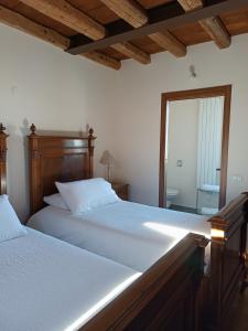 a bedroom with two beds and a window at CASAL MICELIO in Udine