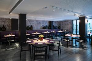 a dining room with tables and chairs at Catalonia Square 4* Sup in Barcelona