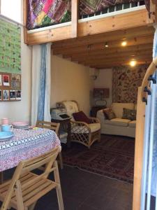 a living room with a table and a couch at The Studio, Trelugga in Helston