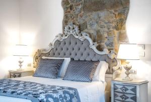 A bed or beds in a room at Residenza le Colline del Paradiso