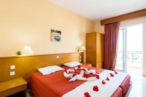 A bed or beds in a room at Summer Memories Aparthotel
