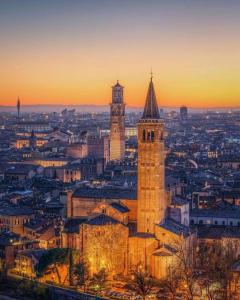 a view of a city with a clock tower at Royal Giardini dell'Arena Relais - Royal Welcome in Verona