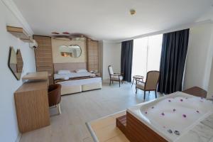 Postel nebo postele na pokoji v ubytování Hotel Caprea