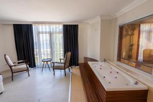 Postel nebo postele na pokoji v ubytování Hotel Caprea