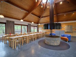 a large room with a long table and chairs at Youth Hostel Larochette in Larochette