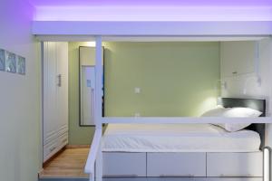 Postel nebo postele na pokoji v ubytování La Filarmonica Sitia Center