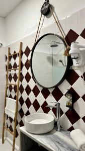 a bathroom with a mirror and a sink at Casa Flor de Sal Apartment in Carvoeiro +53 photos