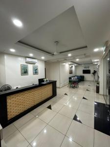 a lobby with a reception desk in a building at ISLAND TIME MOTEL KUAH in Kuah