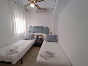 מיטה או מיטות בחדר ב-Rincon Mediterraneo Gran Alacant