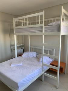 a bedroom with two bunk beds in a room at Senhor Hotel in Juazeiro do Norte