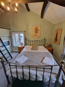 a bedroom with a large bed in a room at Log Burner 3 double bedroom very cosy in Kendal