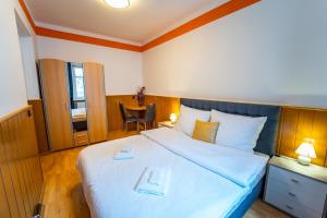 Posteľ alebo postele v izbe v ubytovaní Lukas Apartments