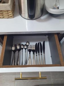 a drawer with a bunch of cooking utensils at Stellar 1-bedroom apartment in Madaraka Estate, Nairobi in Nairobi