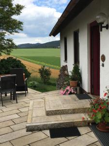 a house with a patio with a view of a field at AUSZEIT für DICH in Himmelkron
