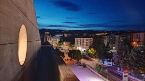 a view of a city at night from a building at Attico al Gallitello in Potenza