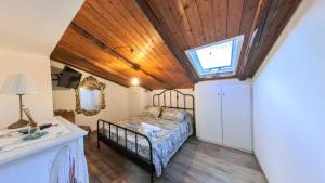 a bedroom with a bed in a room with a window at Due passi dal mare in Montecorice
