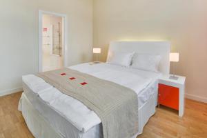 Postel nebo postele na pokoji v ubytování Mamaison Residence Sulekova Bratislava