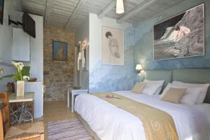 Кровать или кровати в номере Elixirion Guest House