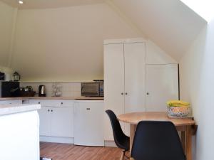 A cozinha ou cozinha compacta de The Stable