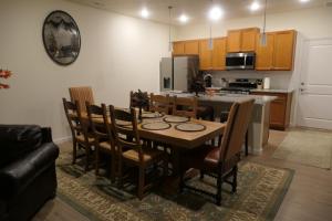 a kitchen with a table and chairs in a room at Well Appointed 3-Bedroom Townhome in Colorado Springs
