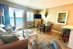 a living room with a couch and a table at Perdido Sky 72 in Perdido Key