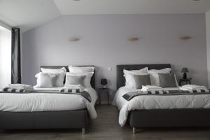 Säng eller sängar i ett rum på Gîte LES ARMINAUX