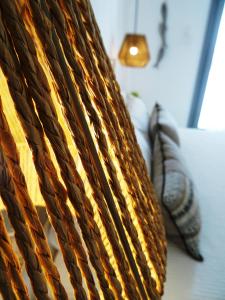 a close up of two pillows on a table at Paros Bay in Parasporos