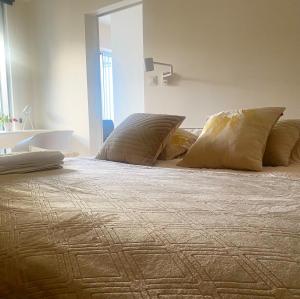 a large bed with two pillows on top of it at Apartament Hanza 615 in Szczecin