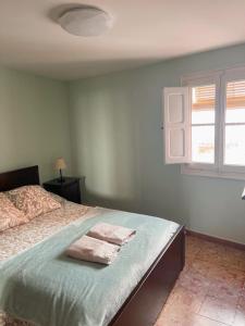 Postel nebo postele na pokoji v ubytování Casa del Bueno