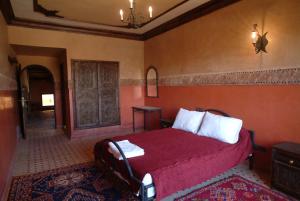 Postel nebo postele na pokoji v ubytování Hôtel LAKASBAH Ait Ben Haddou