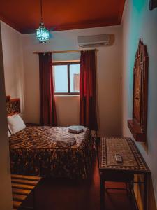 Postel nebo postele na pokoji v ubytování Hôtel LAKASBAH Ait Ben Haddou